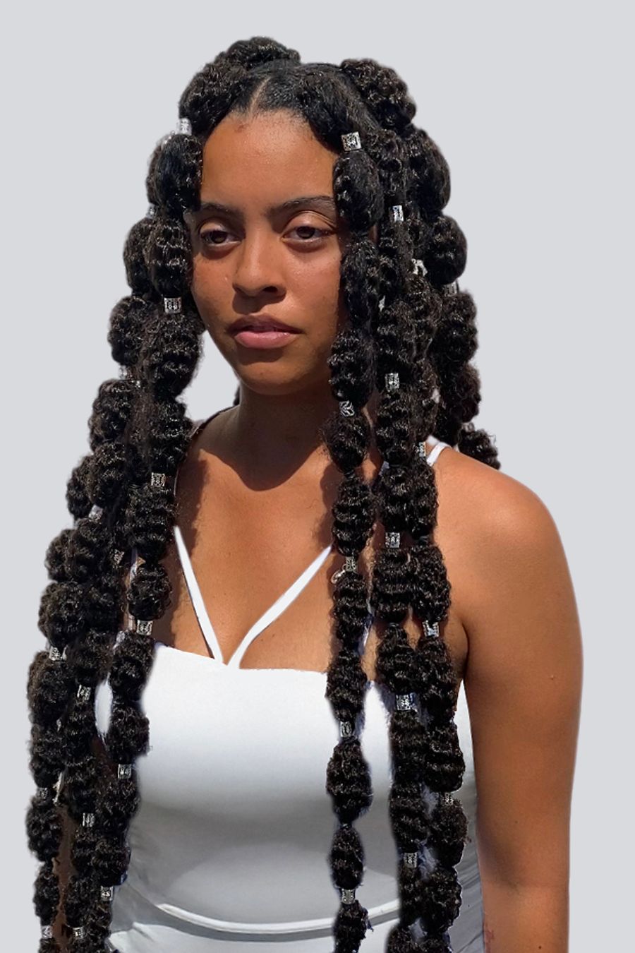 woman wearing large Bubble braids that go down to her waist
