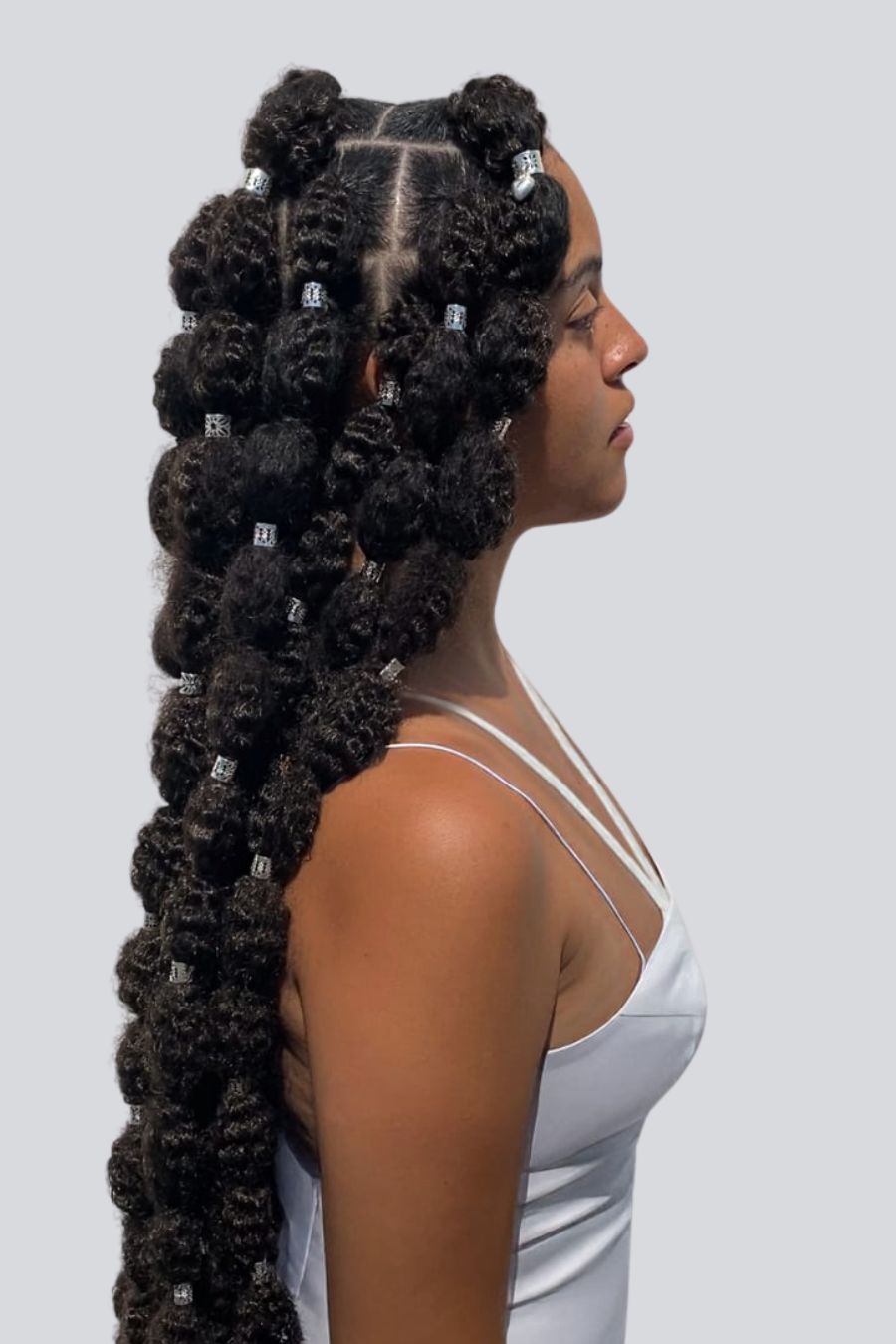 woman wearing large Bubble braids that go down to her waist